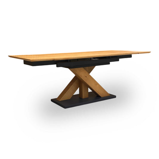 Full view of furniture Village ‘Aydin’ solid oak 150cm extending dining table featuring a modern industrial design with a black metal plinth base.