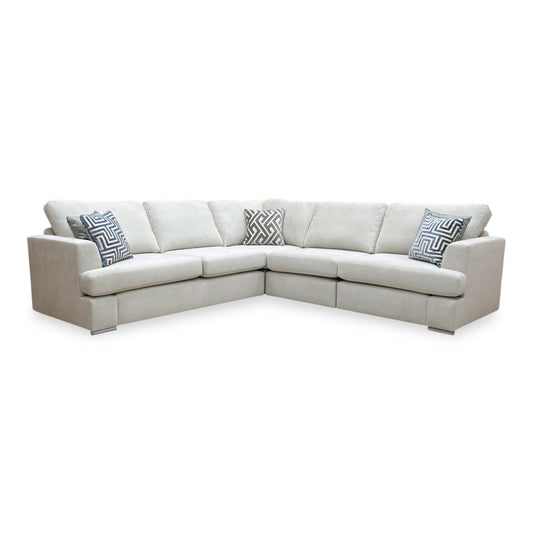 Full view of the ‘Freya’ modular 2-corner-2 sofa upholstered in a soft silver fabric.