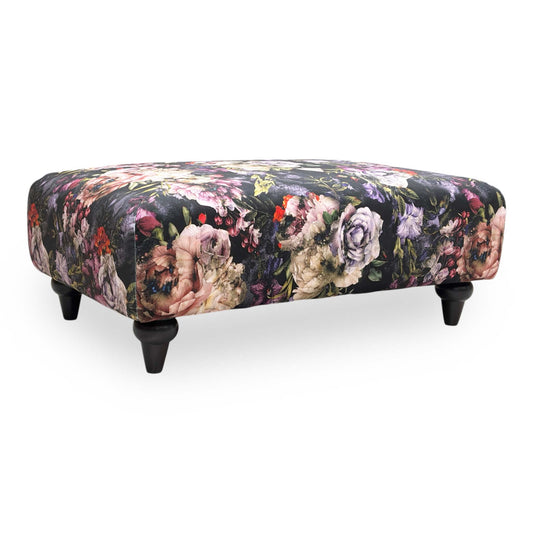 Full view of DFS ‘Dame’ banquette footstool featuring a traditional floral pattern in a soft fabric upholstery.