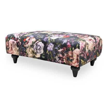 Side perspective of the footstool, highlighting its low-profile design and sturdy cushioned top.