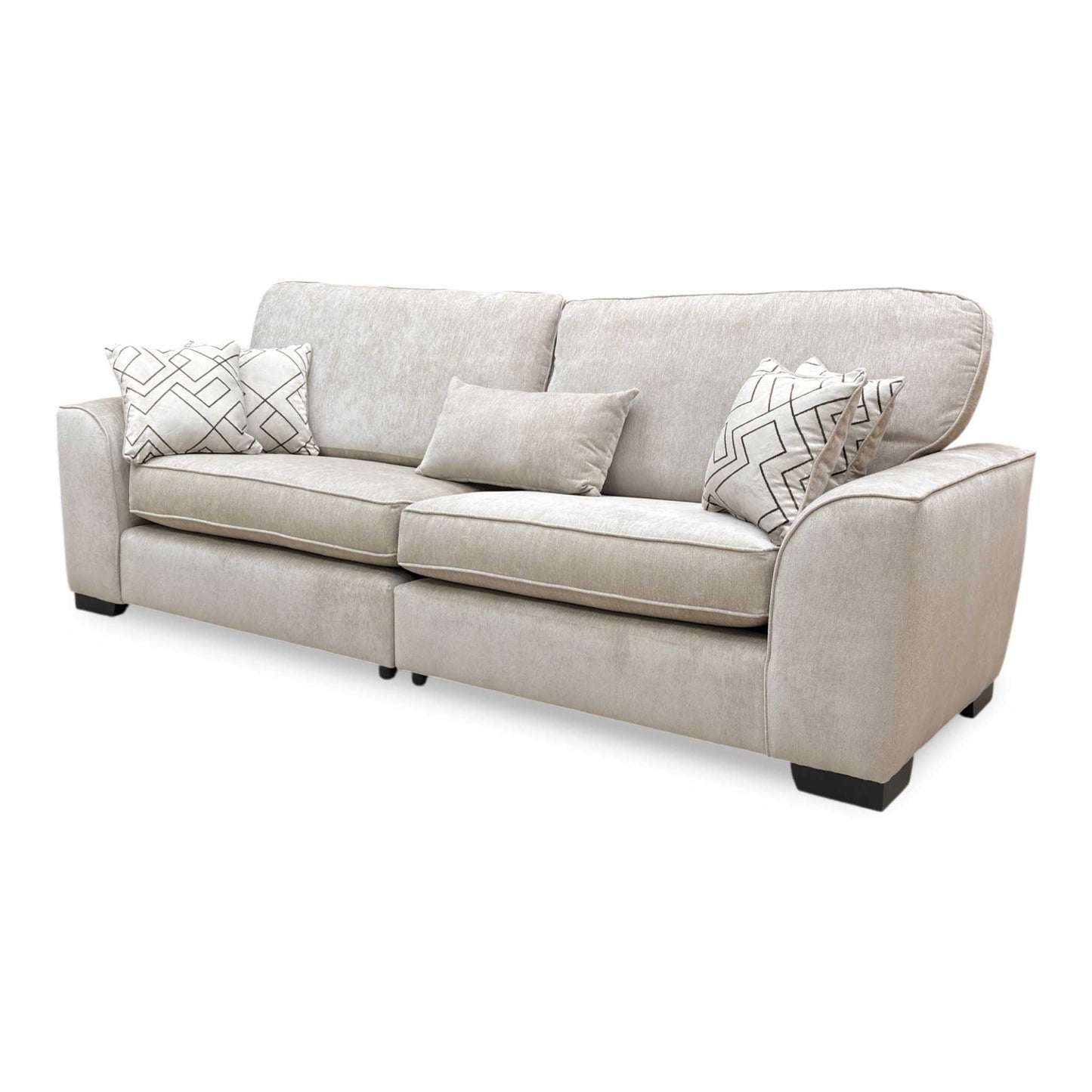 Side view of the Harvey sofa, demonstrating the sleek split frame silhouette and deep cushions.