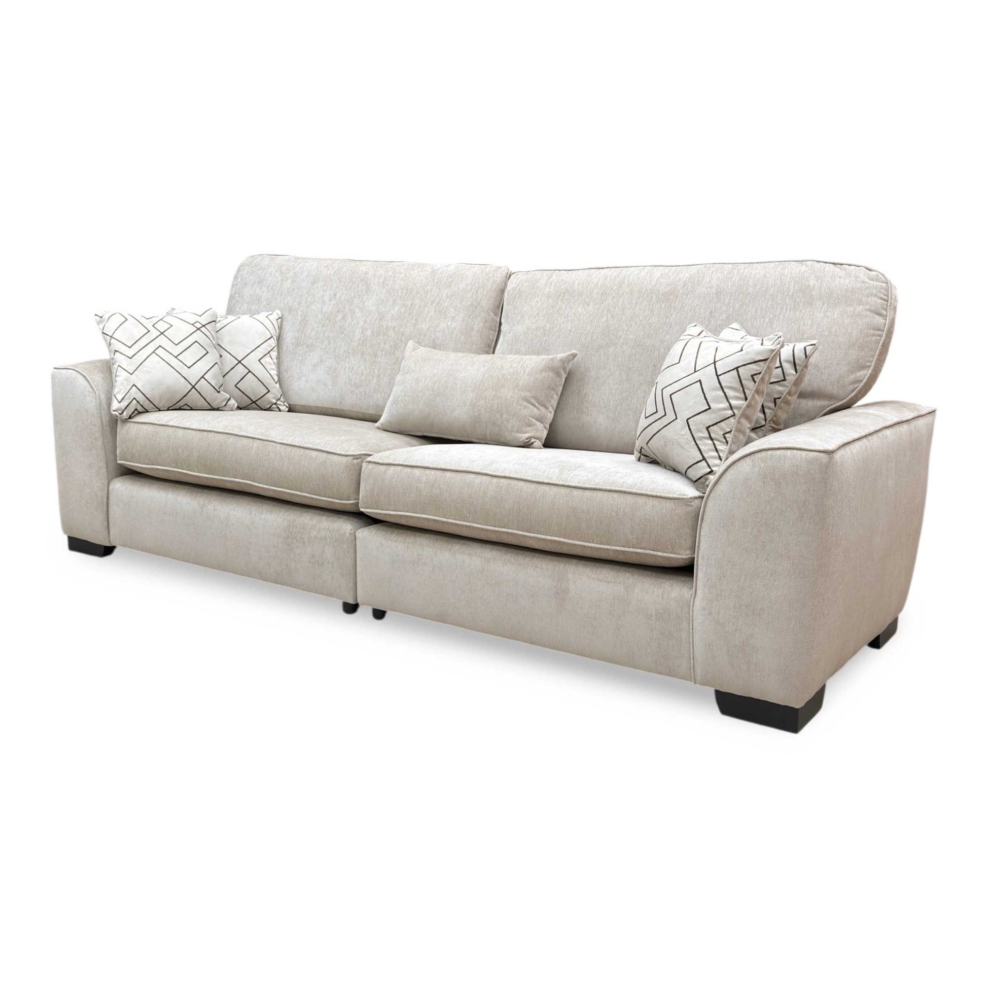 Side view of the Harvey sofa, demonstrating the sleek split frame silhouette and deep cushions.