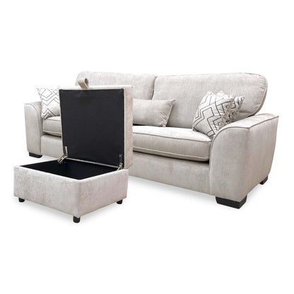 Harvey truffle 4 seater sofa angled from the right with the storage footstool open to show the lined interior