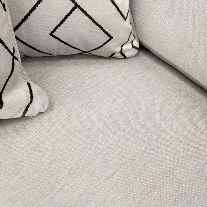 Close-up of the truffle Derwent soft weave fabric on the Harvey sofa seat with a geometric scatter cushion