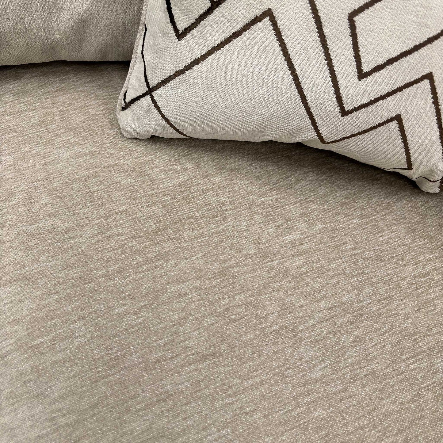 Close-up texture detail of the truffle brown Derwent soft weave upholstery.