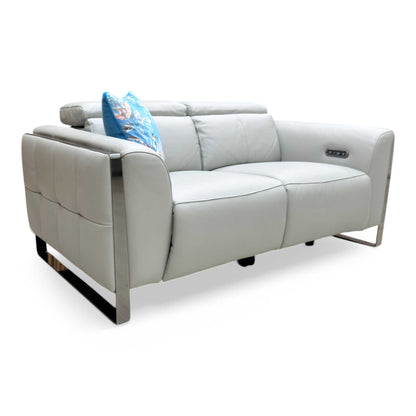 Side profile showing the Gisella sofa in a reclined position with the footrest extended.
