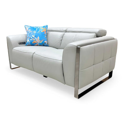 Side profile showing the Gisella sofa in a reclined position with the footrest extended.