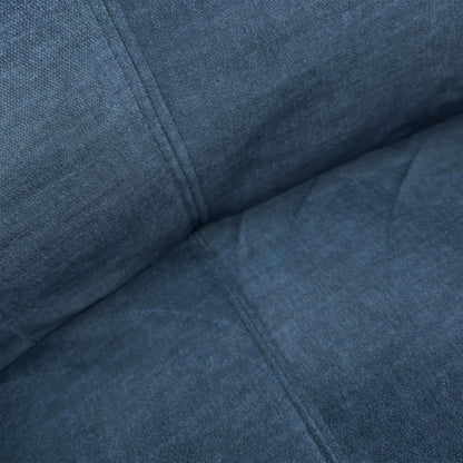 Close-up of the plush Deep Sea Blue velvet upholstery and cushioned backrest.