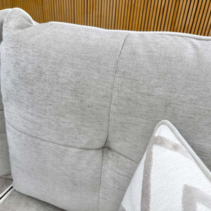 Detailed shot of the high-quality linen fabric texture and reversible fiber-filled back cushions.
