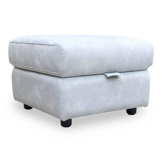 Full view of Sloane storage footstool in Dexter Smoke velvet fabric with a lift-top lid.