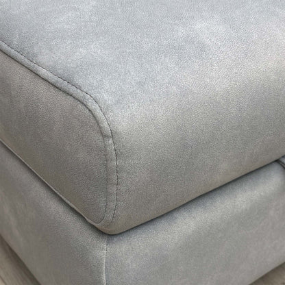 Close up shot of the footstool base and fabric texture.