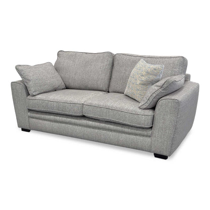 Side shot of the Chalfont sofa, highlighting the elegant flared armrests and the depth of the comfortable back cushions.