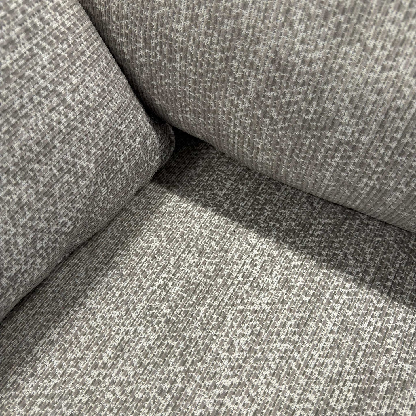 Close-up of the Tamango Grey weave fabric, detailing the multi-tonal grey threads and the durable, high-quality texture of the upholstery.