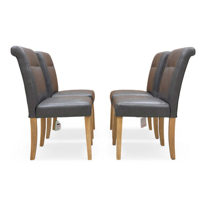 Front view of a single Lewis dining chair showing the high rolled back and button detailing.