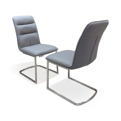 Side profile view illustrating the C-shaped cantilever design and thick ergonomic seat cushioning.