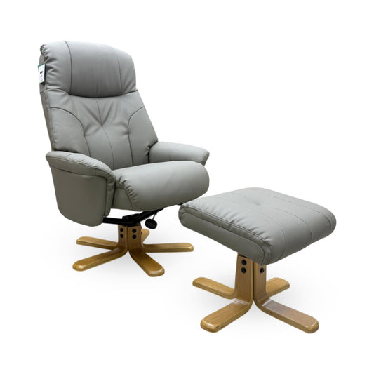 Full view of the Muscat swivel recliner chair and matching footstool in Dark Grey leather, featuring a stylish star-shaped oak base.