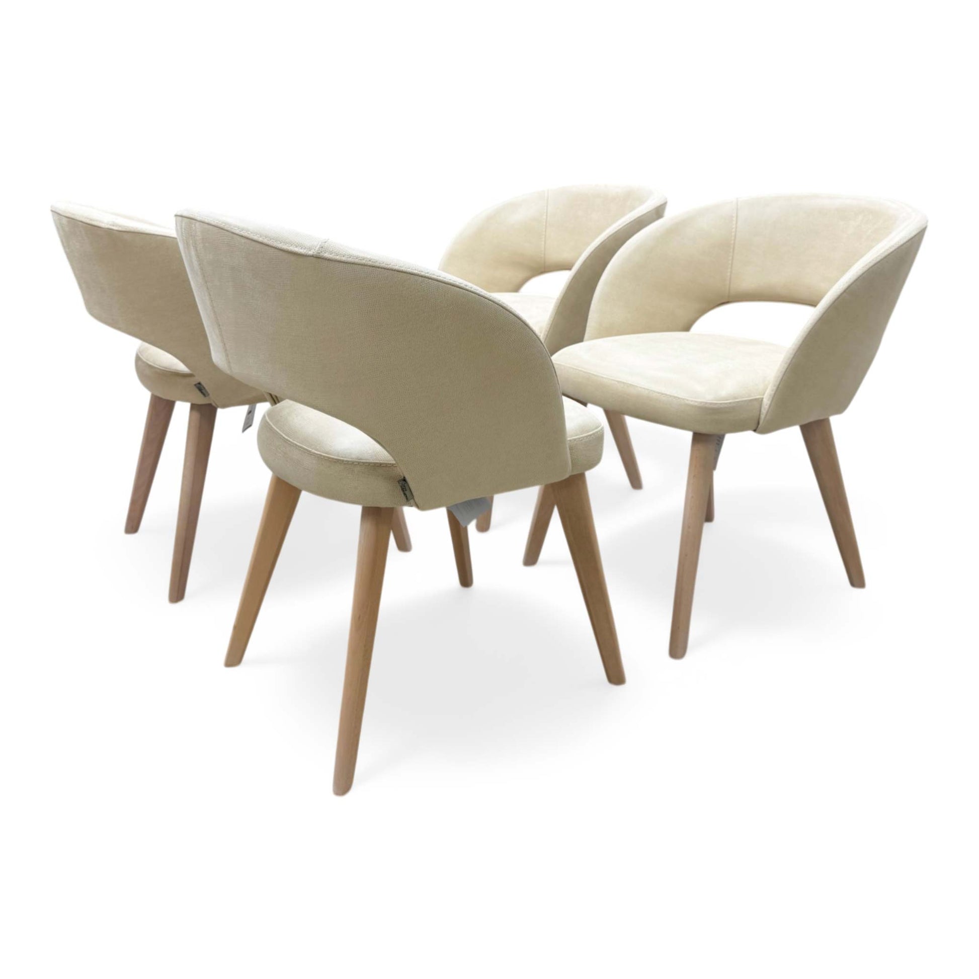 Side view showing the graceful curve of the backrest and the tapered high-quality beech wood frame.