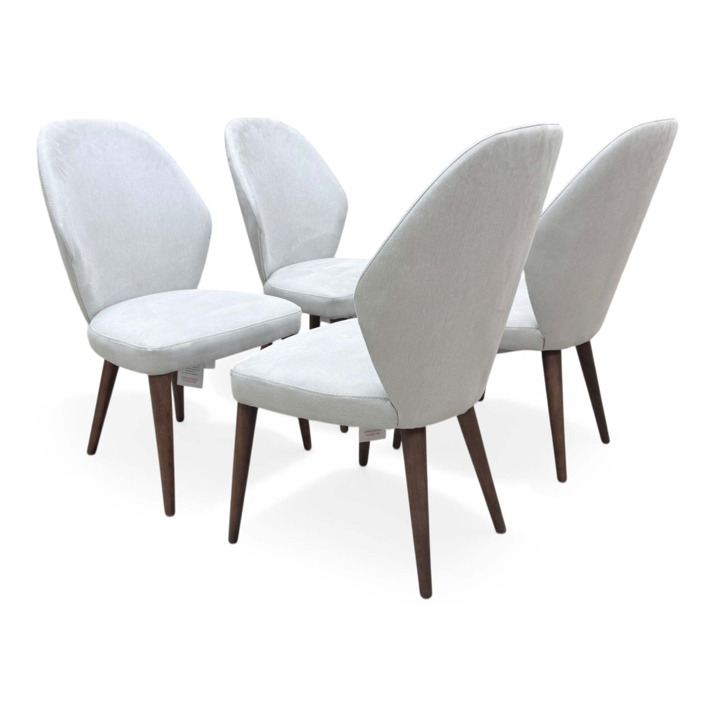 Back view of the set of 4 Empire chairs, emphasizing the uniform elegance and slender leg design.