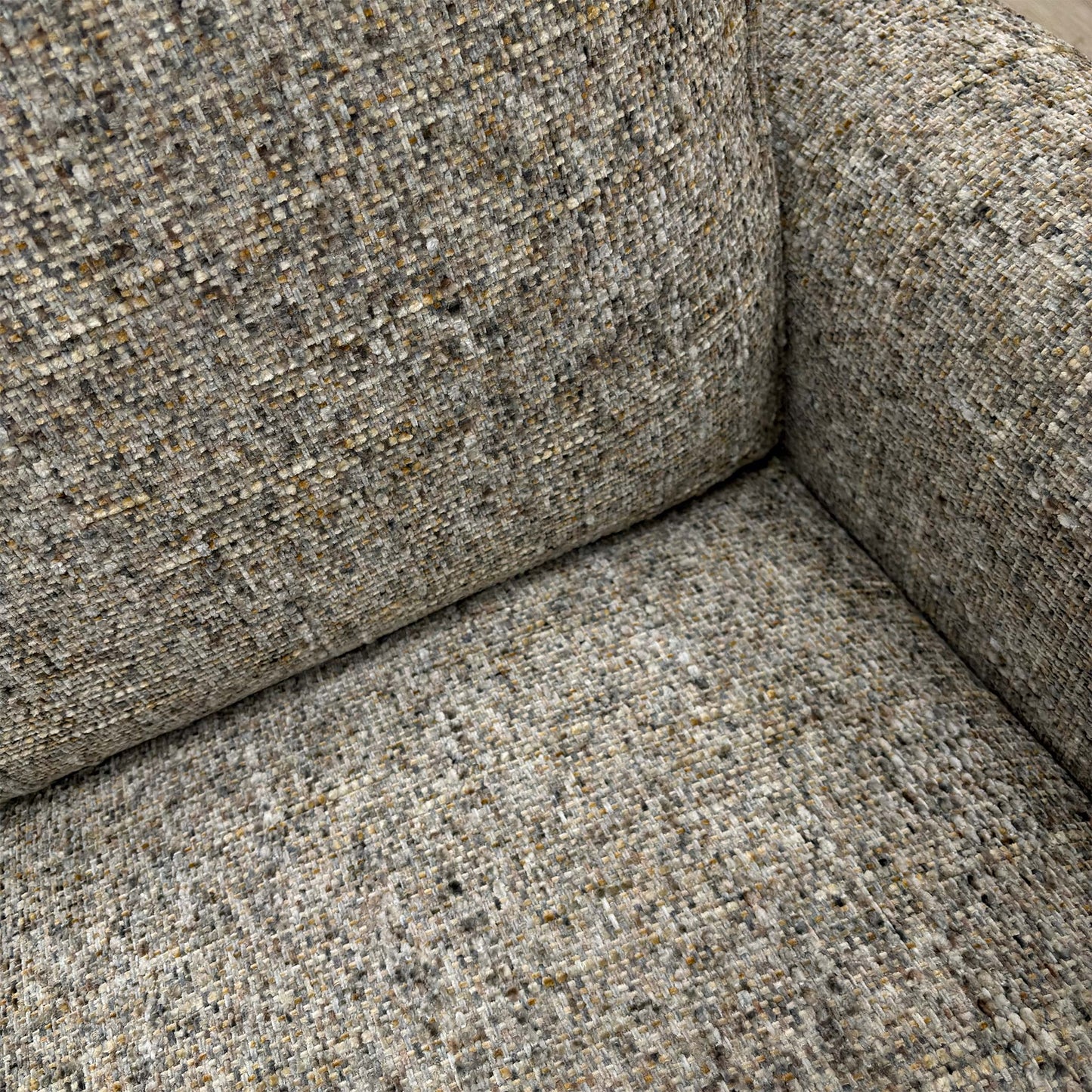 Close-up of the moss grey heather woven fabric, highlighting the textured weave.