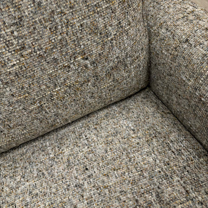 Close-up of the moss grey heather woven fabric, highlighting the textured weave.