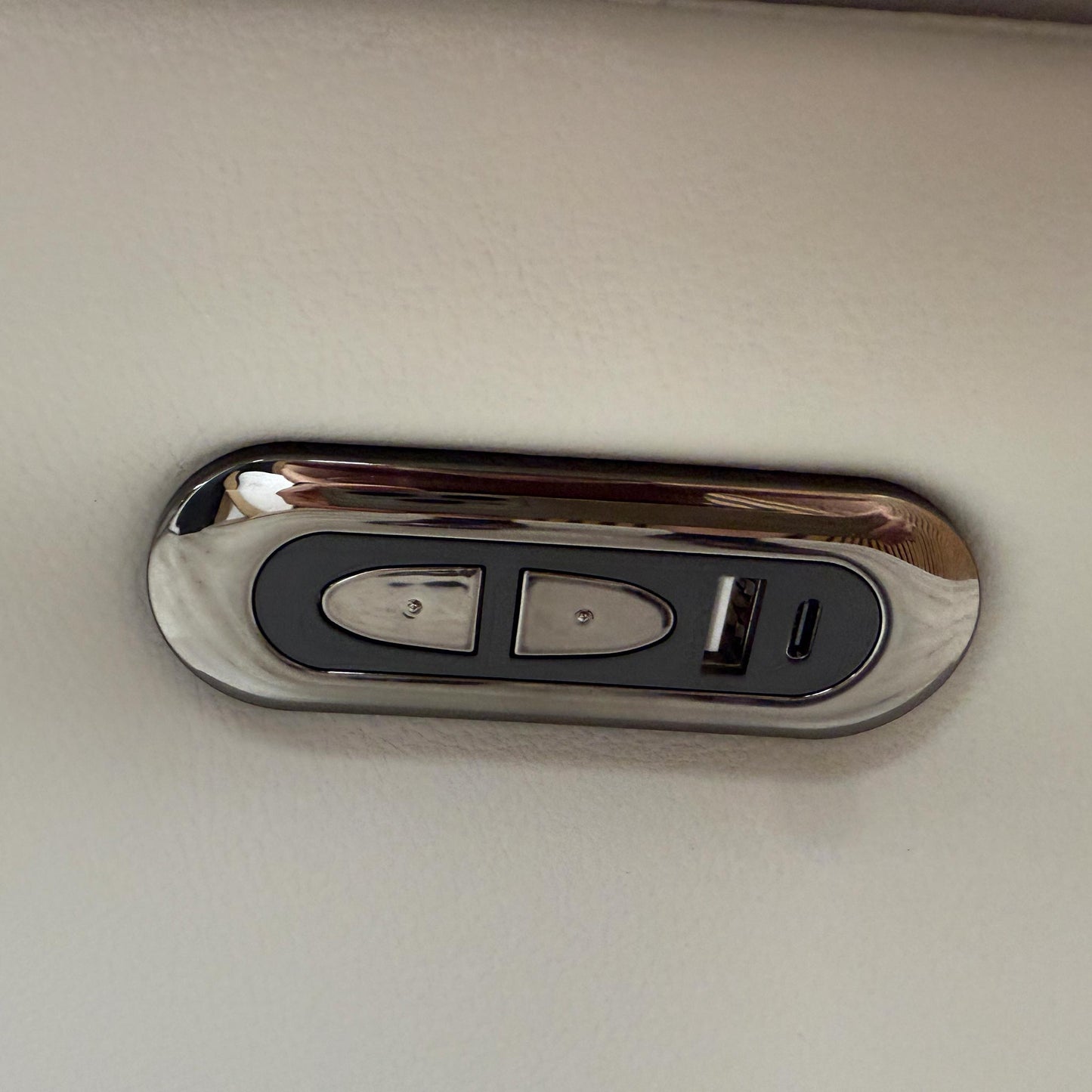 Detailed shot of the integrated power reclining controls located on the side of the Sally sofa for easy adjustment.