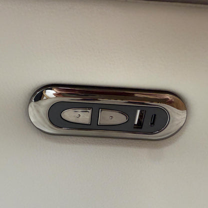 Detailed shot of the integrated power reclining controls located on the side of the Sally sofa for easy adjustment.