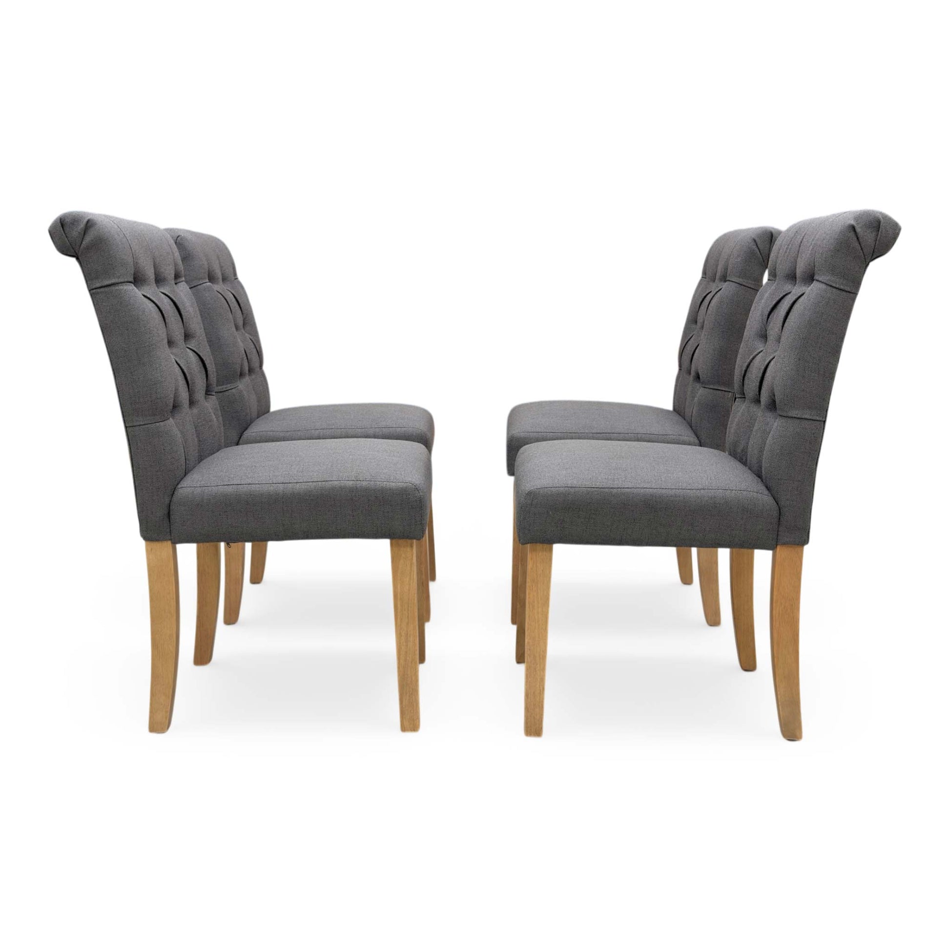 Front view of a single Lewis dining chair, showing the deep-buttoned backrest.