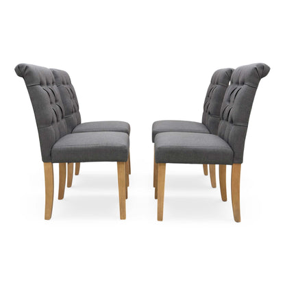 Front view of a single Lewis dining chair, showing the deep-buttoned backrest.