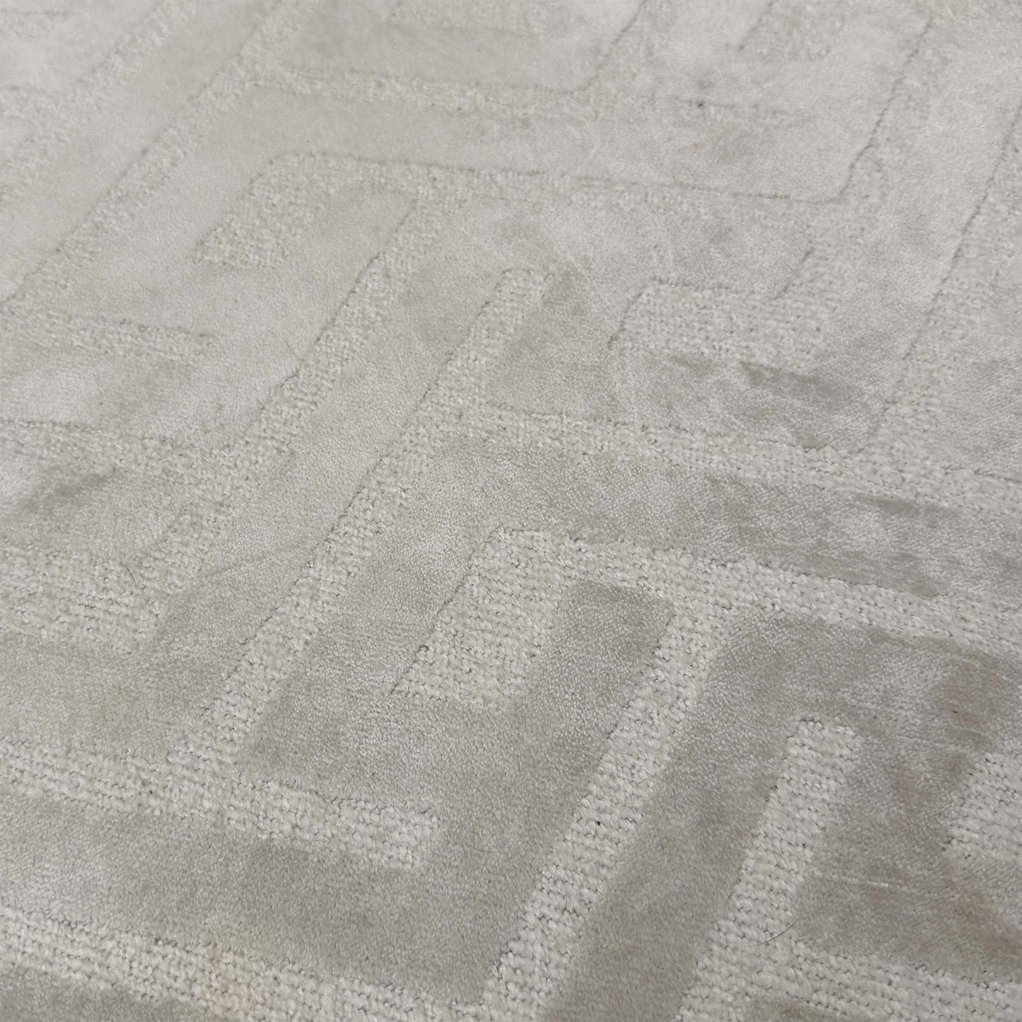 Close-up of the Natural patterned fabric, highlighting the detailed weave, soft beige and cream tones, and the precision of the button detailing.