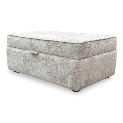 Front view of The Sasha footstool with the lid open, emphasizing the deep internal storage space and the high-quality lining of the compartment.