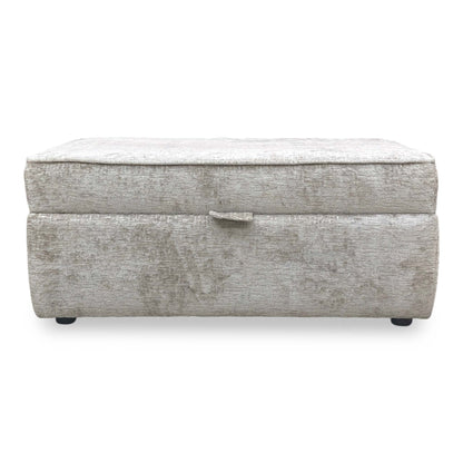 Front view shot of the discreet low-profile feet, showing the expert craftsmanship and structural stability of the footstool base.