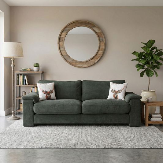 Living room view for the Boxy 4-seater sofa, highlighting the premium Moss Green linen upholstery, generous 2.4m seating area, and contemporary midi arm silhouette.