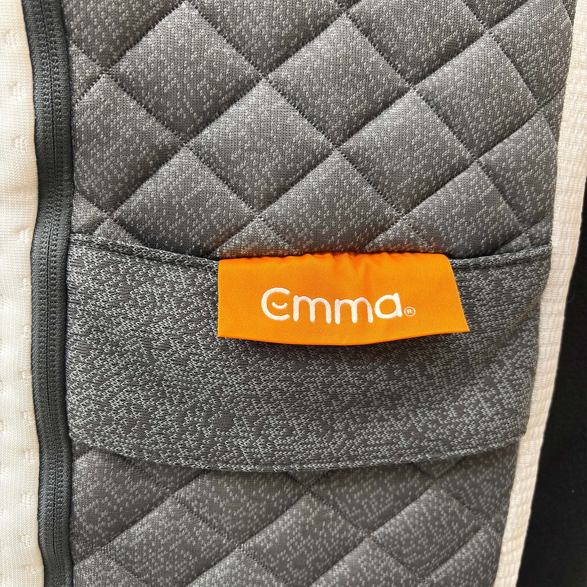Detail shot of the sturdy base layer, showing the expert German engineering and the durable, non-slip bottom of the mattress cover.