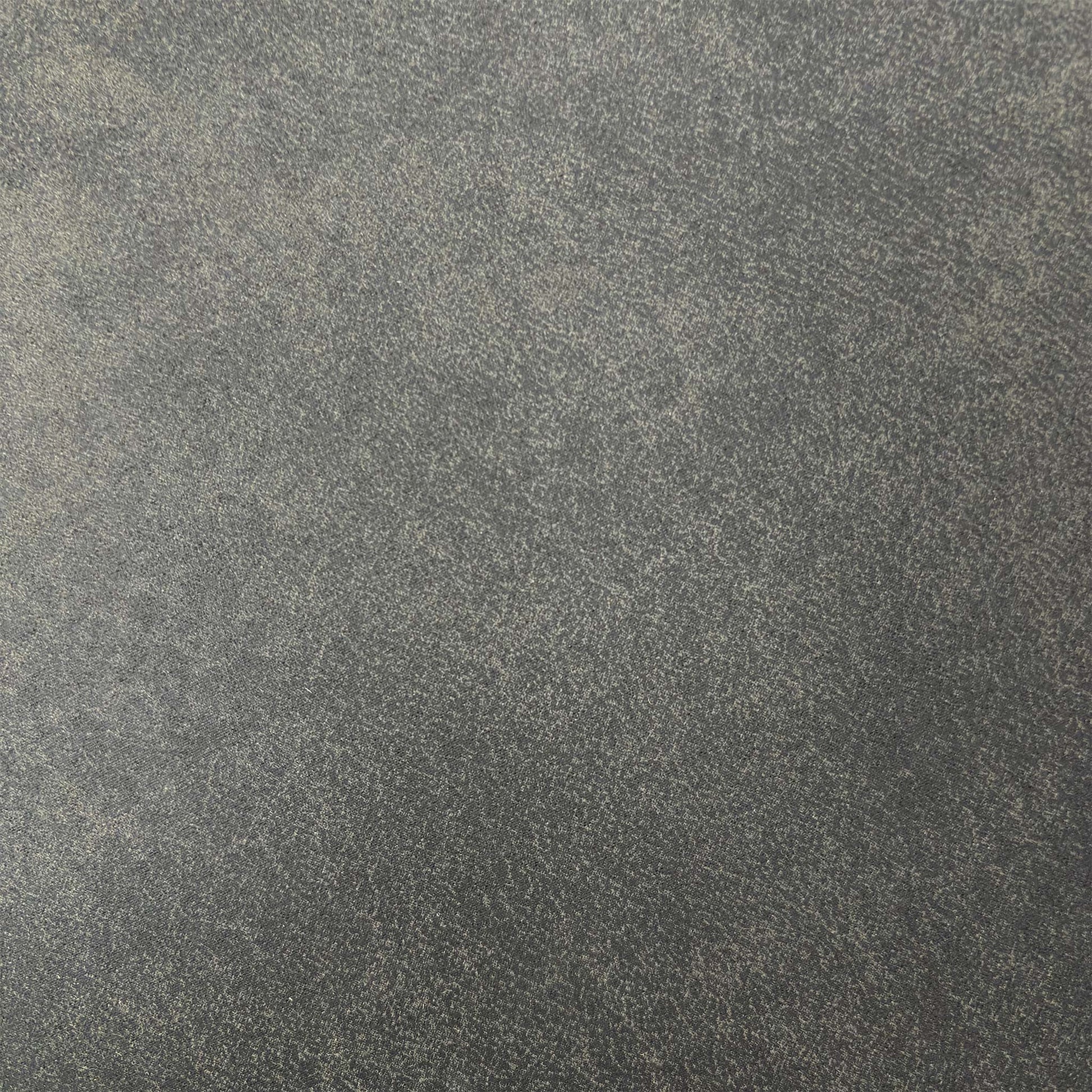 Close-up of the grey fabric and quilted diamond stitching on the backrest, highlighting the quality craftsmanship and tactile finish.