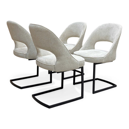 Full view of Set of 4 ‘Tiber’ cantilever dining chairs in Alabaster Beige fabric, featuring a modern curved silhouette and sleek chrome U-shaped legs.