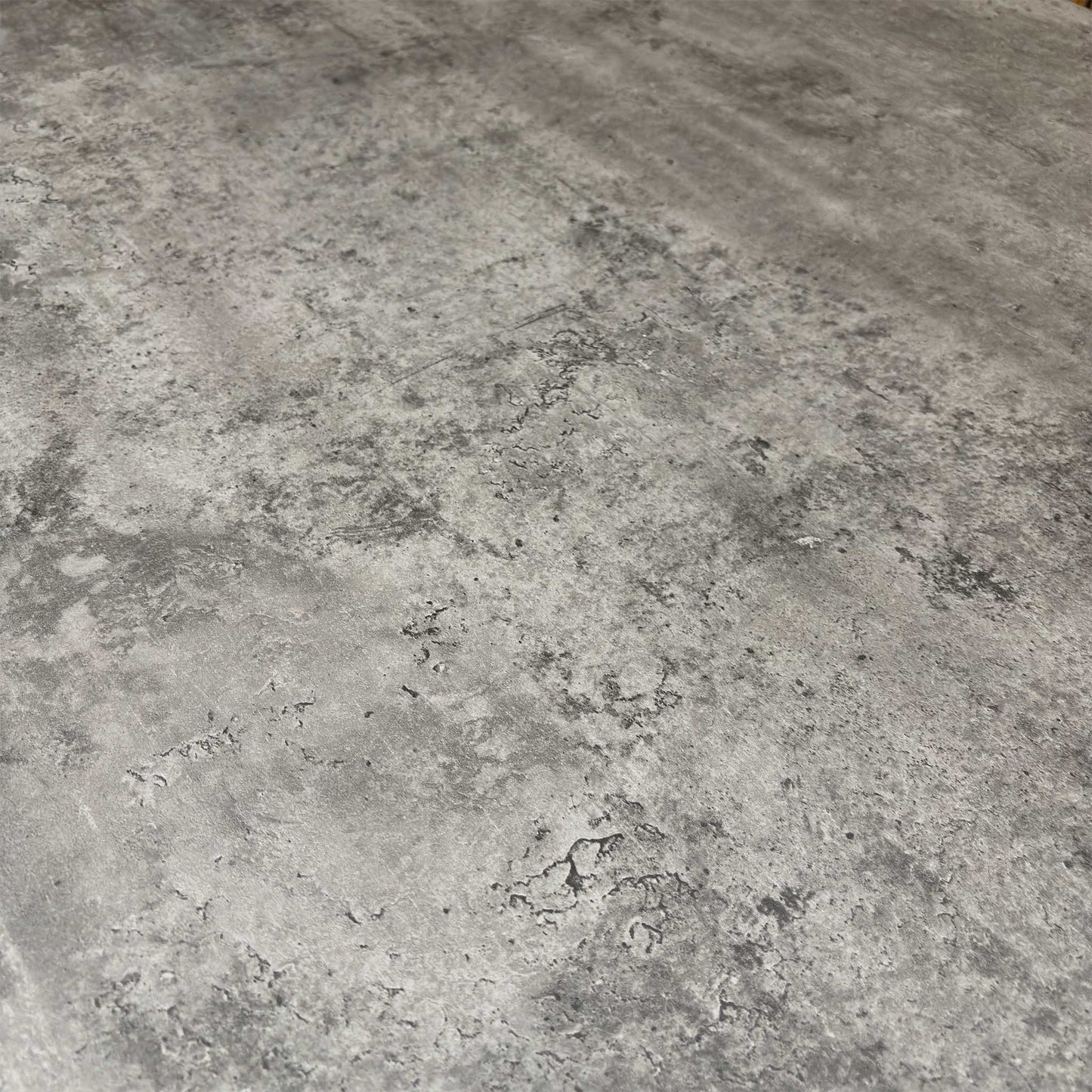 Close-up of the grey concrete-effect finish, emphasizing the realistic industrial texture and durable, easy-clean tabletop.