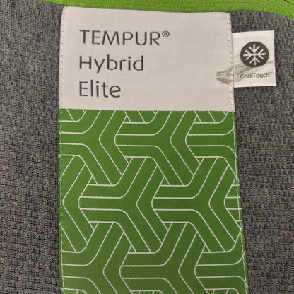 Close-up of the TEMPUR quilted mattress cover, highlighting the breathable fabric texture and the iconic TEMPUR branding on the mattress corner.