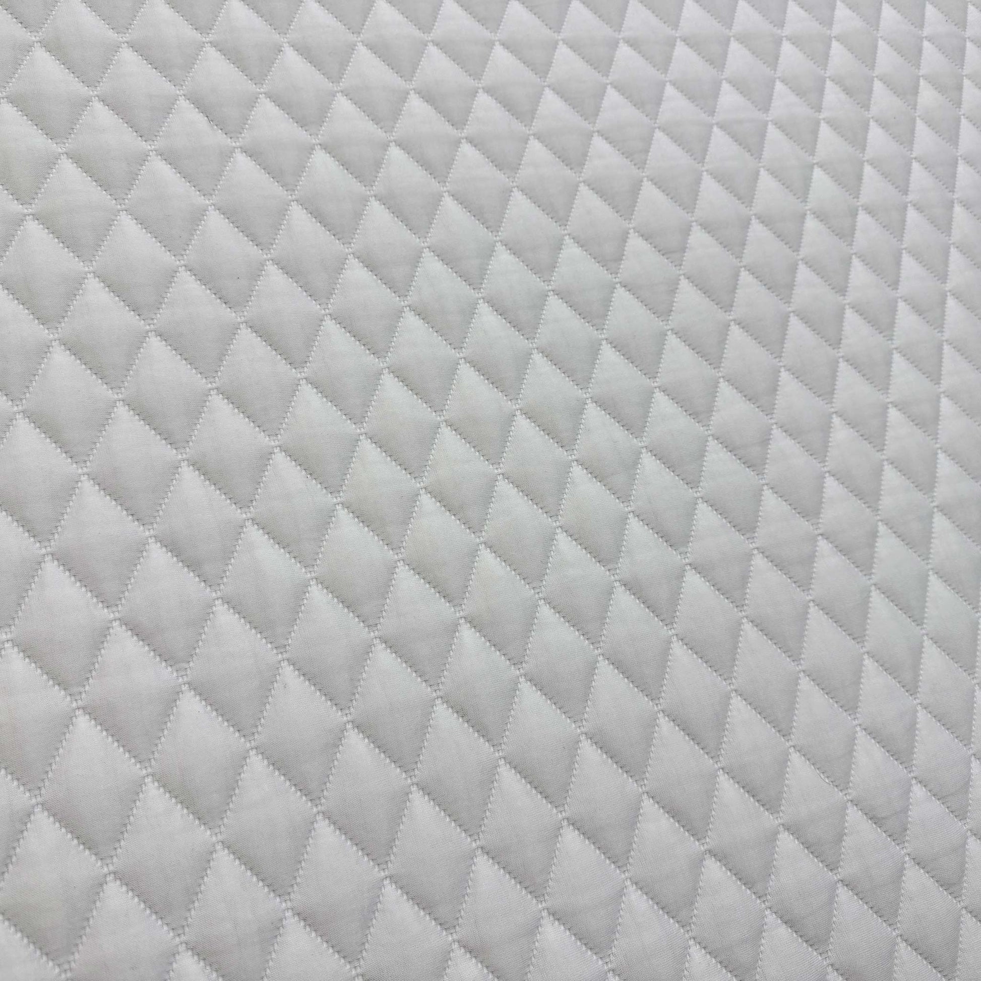 Close-up of the grey woven side border, emphasizing the heavy-duty stitched handles for easy mattress rotation.