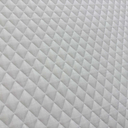 Close-up of the grey woven side border, emphasizing the heavy-duty stitched handles for easy mattress rotation.