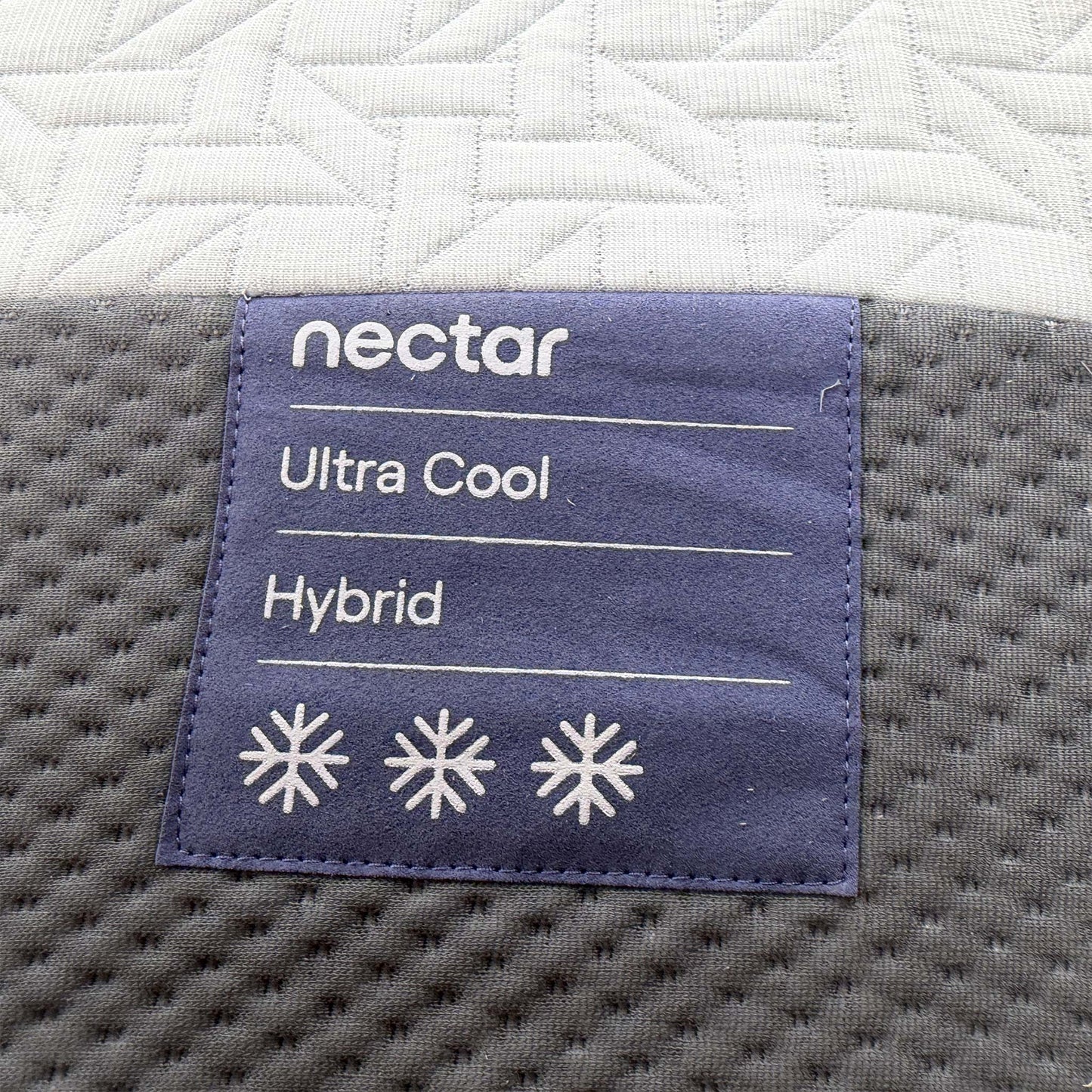 Detailed shot of the cooling fabric cover, highlighting the textured weave designed to regulate temperature and provide a refreshing feel.