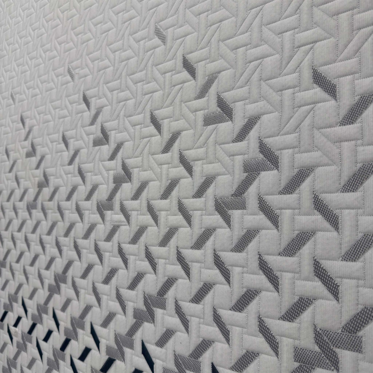 Close-up of the Nectar branding on the mattress corner, showcasing the premium stitching and the 29cm depth of the hybrid memory foam and spring layers.