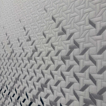 Close-up of the Nectar branding on the mattress corner, showcasing the premium stitching and the 29cm depth of the hybrid memory foam and spring layers.