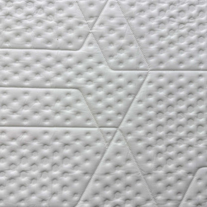Close-up of the Emma UltraDry™ breathable top cover, highlighting the textured hexagonal knit pattern designed for temperature regulation.