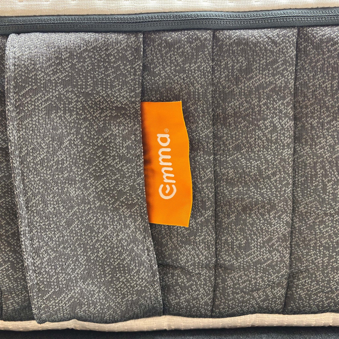 Macro view of the Emma Original hypoallergenic top cover fabric, emphasizing the breathable knitted mesh texture and moisture-wicking design.