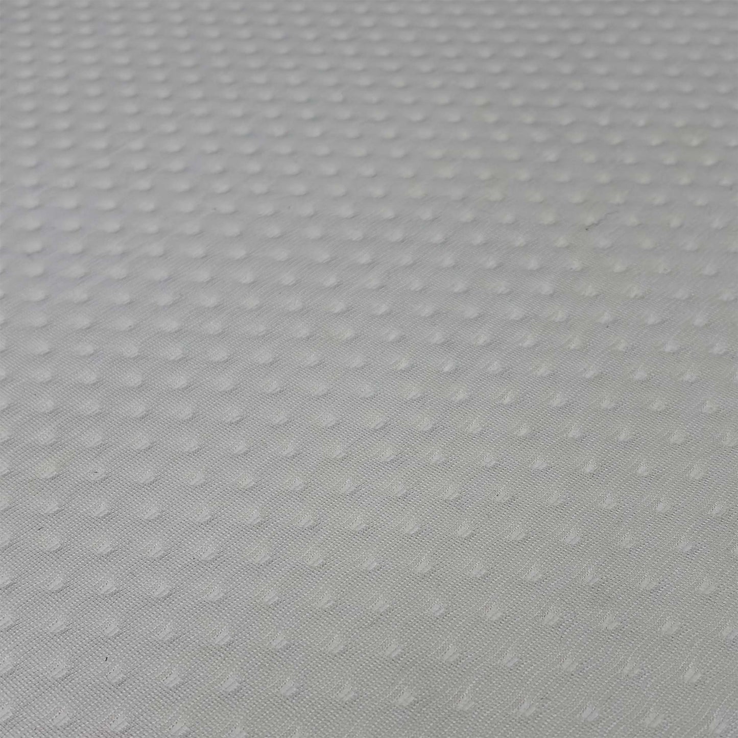 Close up view of the Emma Original hypoallergenic top cover fabric, emphasizing the breathable knitted mesh texture and moisture-wicking design.