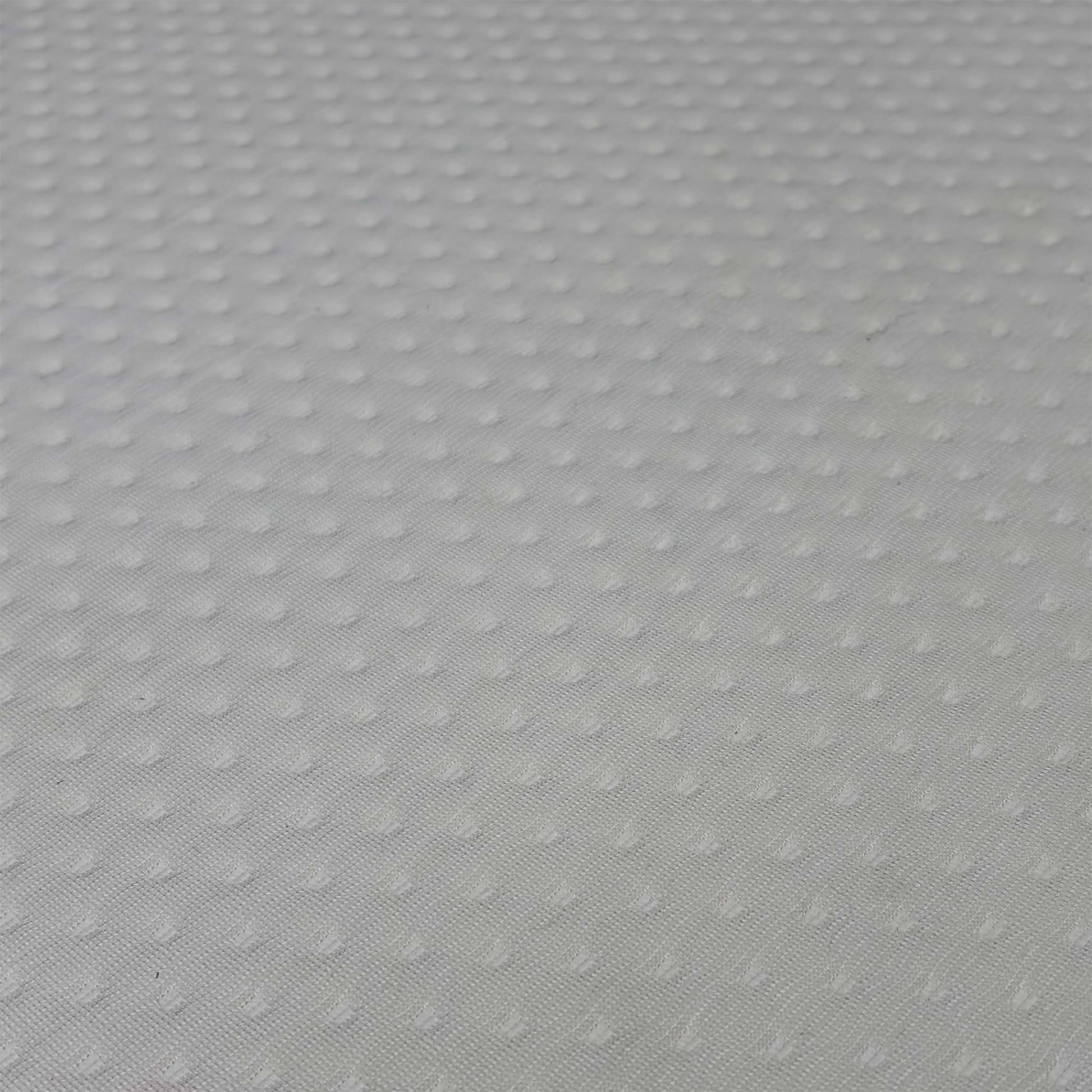 Close up view of the Emma Original hypoallergenic top cover fabric, emphasizing the breathable knitted mesh texture and moisture-wicking design.