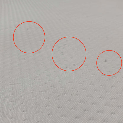Detail shot of the breathable Ultra-Dry top cover, emphasizing the moisture-wicking properties designed to keep you cool and dry throughout the night.
