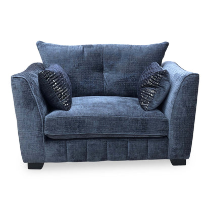 Full view of the ‘Allure’ snuggler chair in Coco Indigo woven fabric, featuring a classic back design, deep cushioned seating, and elegant tapered wooden legs.