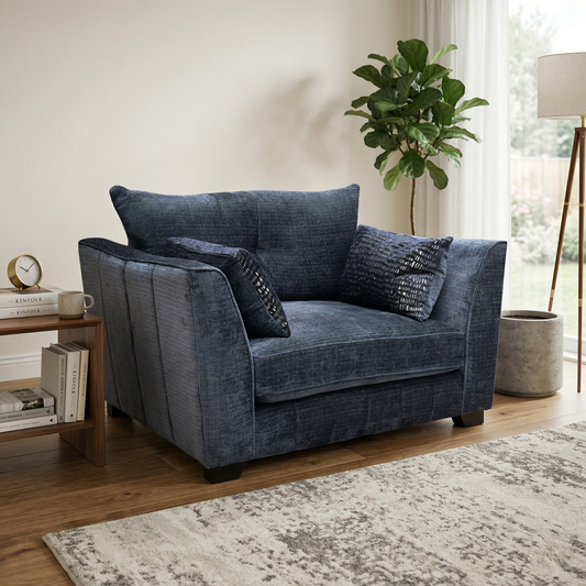 Living room view for the Allure Coco Indigo snuggler, highlighting the high-quality woven fabric, spacious 1.5-seater design, and premium comfort filling.