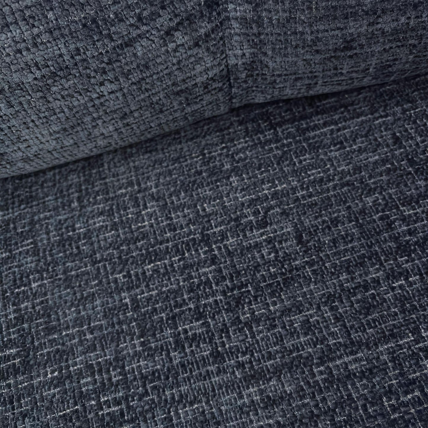 Close-up of the Allure snuggler chair, showcasing the detailed Indigo woven fabric and the generous seating area perfect for relaxation.